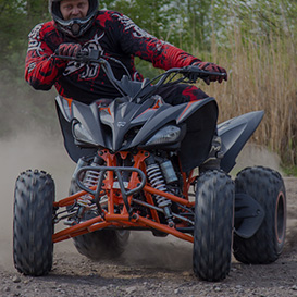 A driver drifting with a big ATV