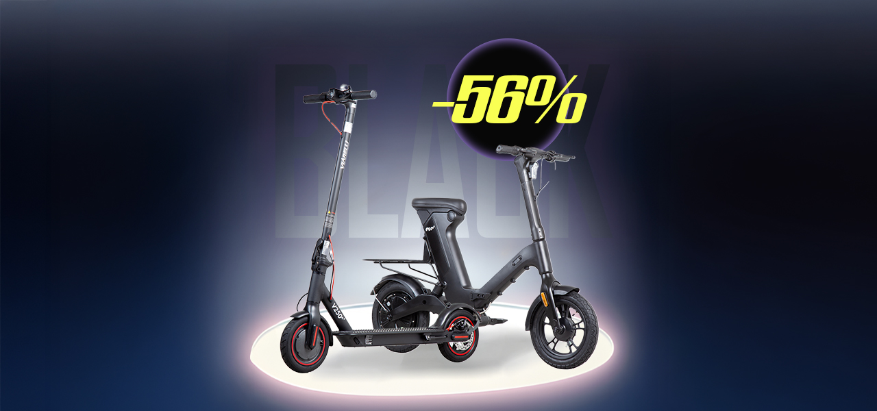 Man står på en elsparkcykel på en stig omringad av natur