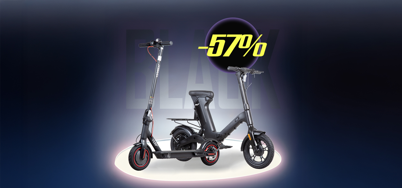 Man står på en elsparkcykel på en stig omringad av natur