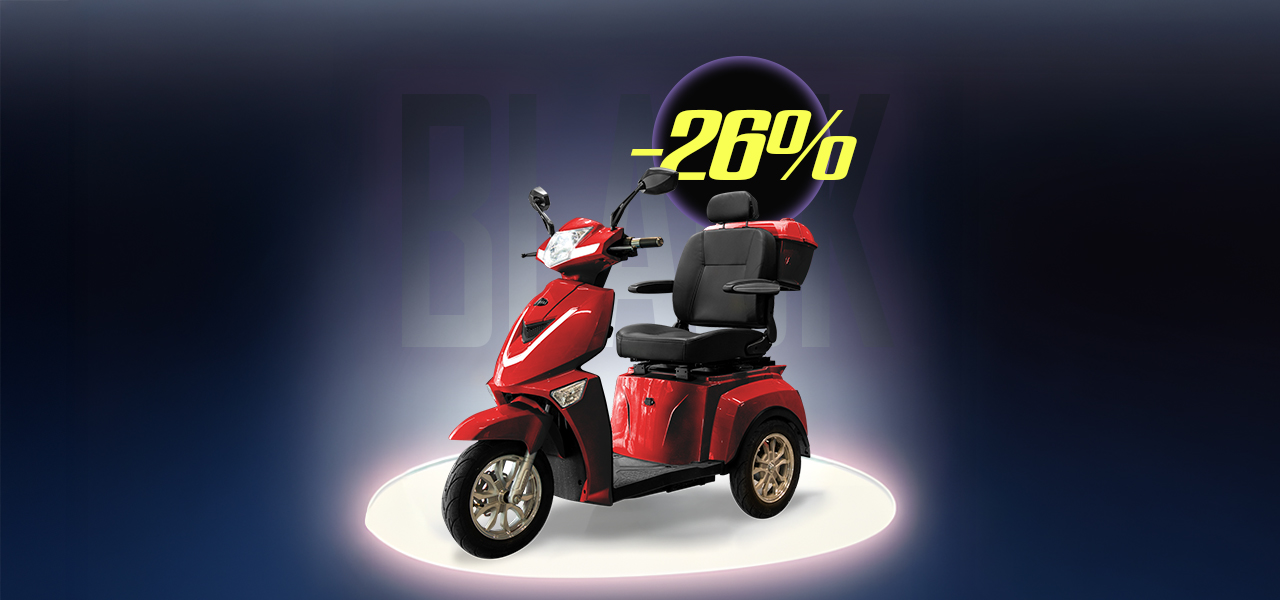 Vit elcykel bland björkar