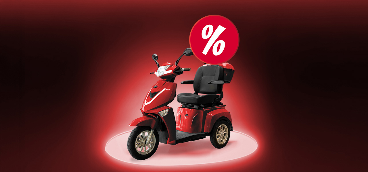 Vit elcykel bland bj&ouml;rkar